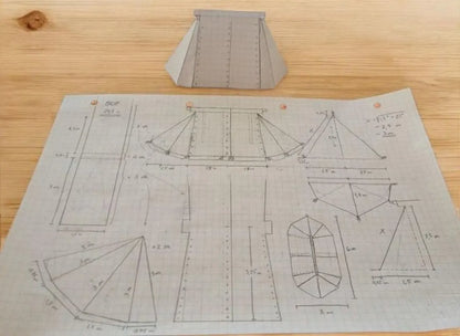 Fabric pattern with measurements on a wooden surface